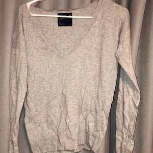 Grey, V-neck, long sleeved